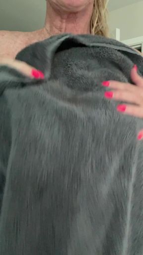 Blonde woman holding a fur coat