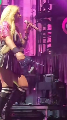 Thick celebrity babe shows off her big tits and tight upskirt