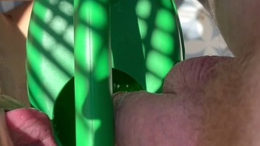 Ginger guy peeing in a plastic watering can in front of his horny naked friend who seems eager to drink piss