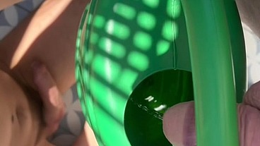 Ginger guy peeing in a plastic watering can in front of his horny naked friend who seems eager to drink piss