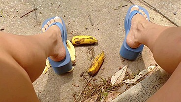 Crushing fruit in big flipflops