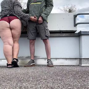 Spanking my mother in law&#039;s gorgeous fat ass while she jerks off my cock on the top of the parking lot