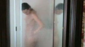 Voluptuous girlfriend pets her snapper while taking a shower