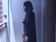 Hari smokes on her balcony