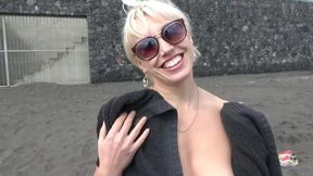 Horny blonde hot masturbates on a public beach
