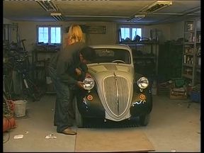 Blonde whore gets fucked by a black cock on the hood of the car