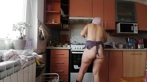 Naughty MILF strips and teases with big melons and rear