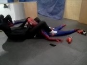 black sex drone playing with his spiderman dummy