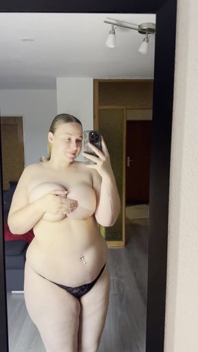 Amateur with big tits and ass exposes her body for a naughty photoshoot.