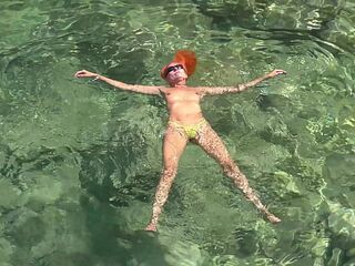 Yellow swimming trunks and blue water