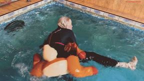 Alla jumps on a rare inflatable reindeer into a pool and it bursts