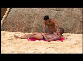 Anal doggy-style on the beach under the sun