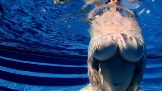 BBW babe shows off huge naturals in the pool underwater POV