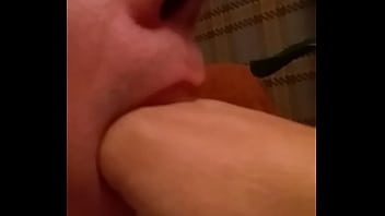 Slut gagging on own hand down his throat