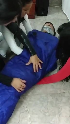 Latino Hunk Heavily Mummified by Cooperative Femdom Women