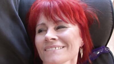 Redhead mature woman spreads legs to get a big black cock