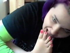 Goth emo girl licks her own feet