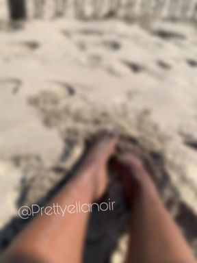 Sandy beach feet POV