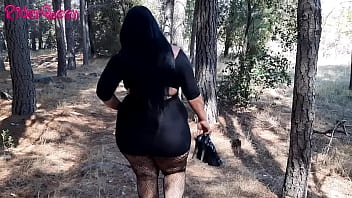 Walking through the forest in my low-cut black dress, I like to go masturbate to satisfy my desires.