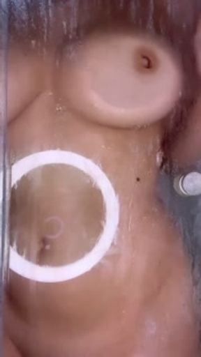 Busty hottie showing herself in the shower