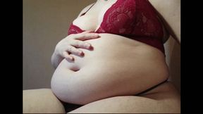 Sensual playing with big fat belly and boobs in tight lingerie