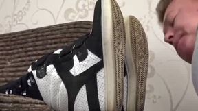 Man smelling dirty sock