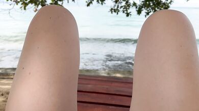 Beach babe flashes pussy and fingers herself in paradise