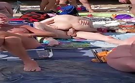 Two horny sluts fucking at the nude beach