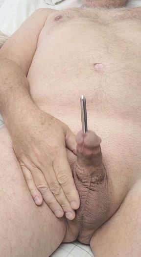 Masturbating with sounding rod in my cock