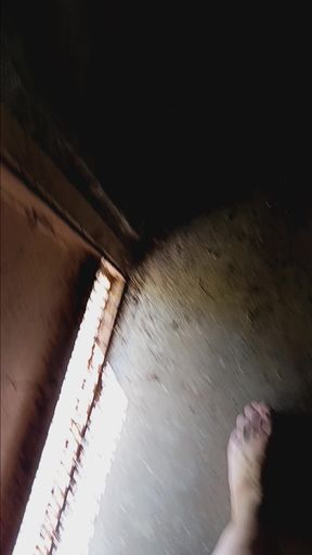 The walks naked in a garage