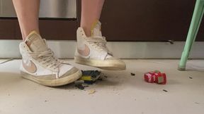 Old ruined Toy cars crushed under Nike blazer and fila disruptor sweaty sneakers