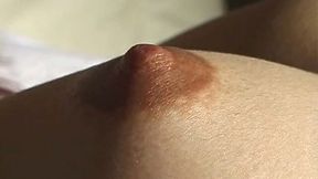 Hard brownish nipples of Japanese bimbo Mari Taichi get licked gently