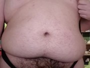 Fat guy wearing bodysuit strips and cums
