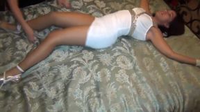 Girls Tying Each Other On A Bed