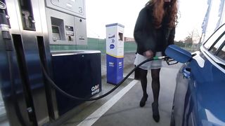 Getting gas crossdressed in white mini-skirt