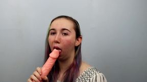 Amateur girl practices sloppy blowjobs on a dildo