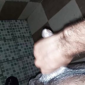 boy masturbates while listening to Chinese music in the bathroom