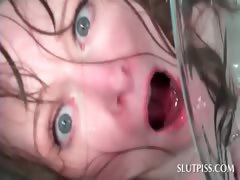 Tied up sex slave gets a bowl of piss poured on her face