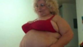 Grandma with giant fat belly flaunts her obese body in red lingerie