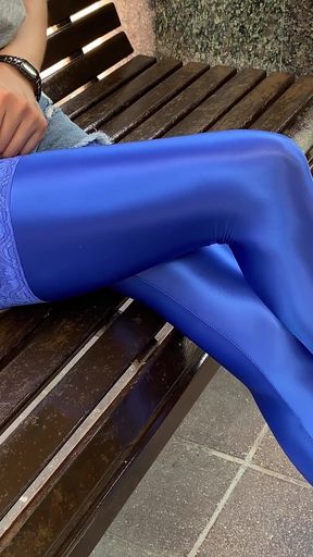 719 Blue shiny spandex stockings in the park