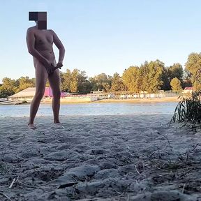 Dude pissing, jerking and cumming at nude beach. Got caught