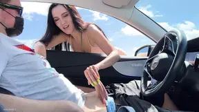 Sexy stranger in a short dress sucks cock in a public parking lot