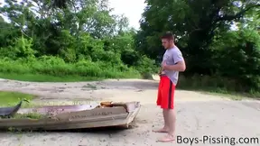 Muscled jock Elijah Knight is pissing and stripping outdoors