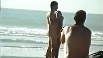 Muscular daddy shows off his big cock on a public beach