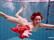 Sexy naked twat Avenna swims nude in the pool