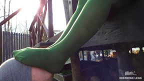 My nylon feet in green tights on your face