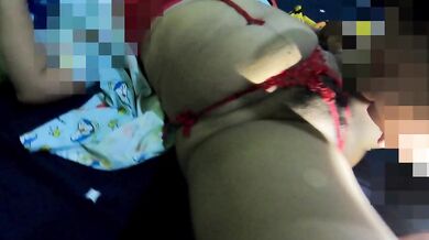 A plump woman in a red G-string. Worth catching a pussy her.