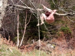 Naked self-bondage in the woods gone wrong.