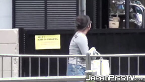 Japanese with big tits peeing on parking & later in