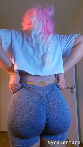 Thick pink-haired thot with a huge bum pulling up her tight booty shorts in close-up angle